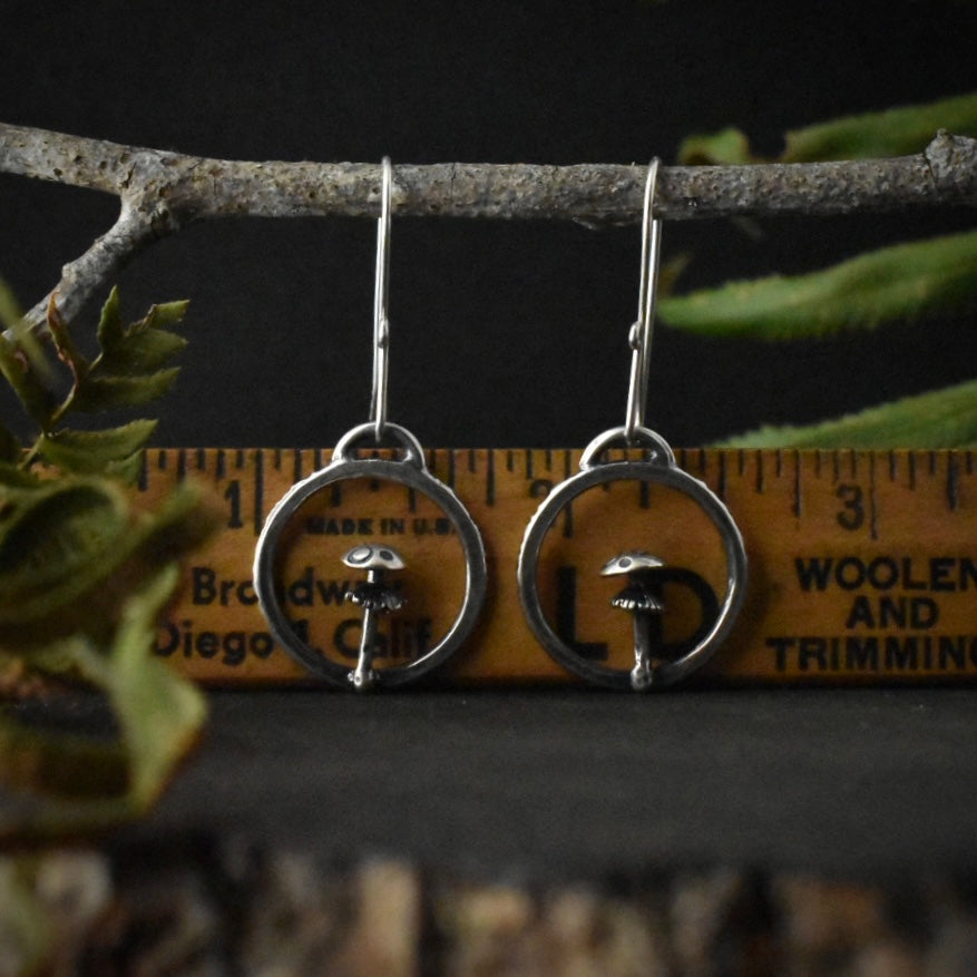 The Amanita Hoop Earrings with a ruler for scale, each measuring around 3/4 inches wide.