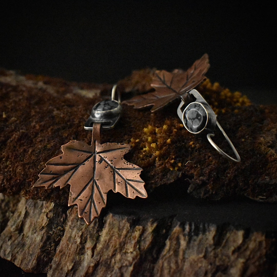 Another look at the Snowflake Obsidian Maple Leaf Earrings, showing their sterling silver ear wires.