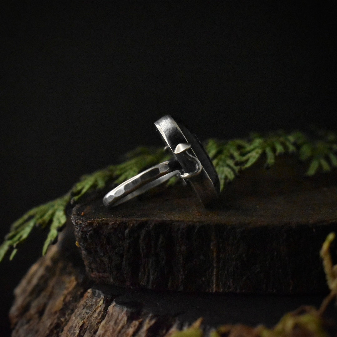 The left side of the Rutilated Quartz Fungal Ring, showing one of its sterling silver elements formed to look like a mushroom.