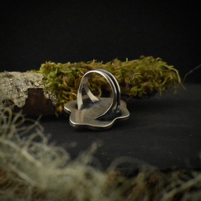 The underside of the Crazy Lace Agate Wiggle Ring, showing its size 5 1/4 sterling silver double ring band.