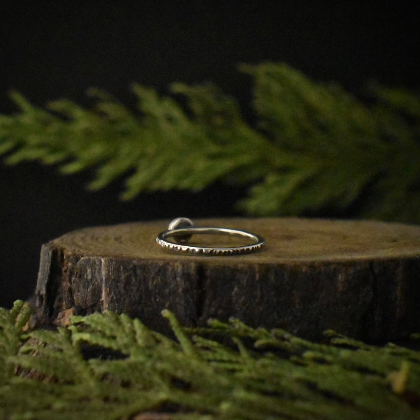 The back of the first Chrysoprase Stacking Ring, showing its size 7 1/2 sterling silver ring band, textured to look like tree bark.