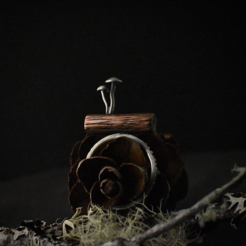 Another look at the Mushrooms on a Log Ring, showing its size 6 1/4 sterling silver ring band.
