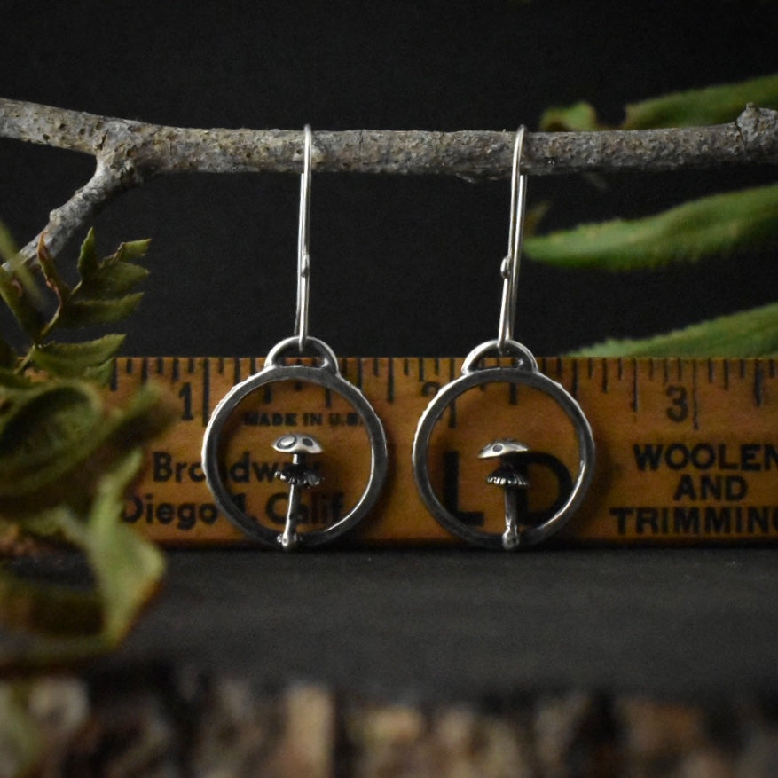 The Amanita Hoop Earrings with a ruler for scale, each measuring around 3/4 inches wide.