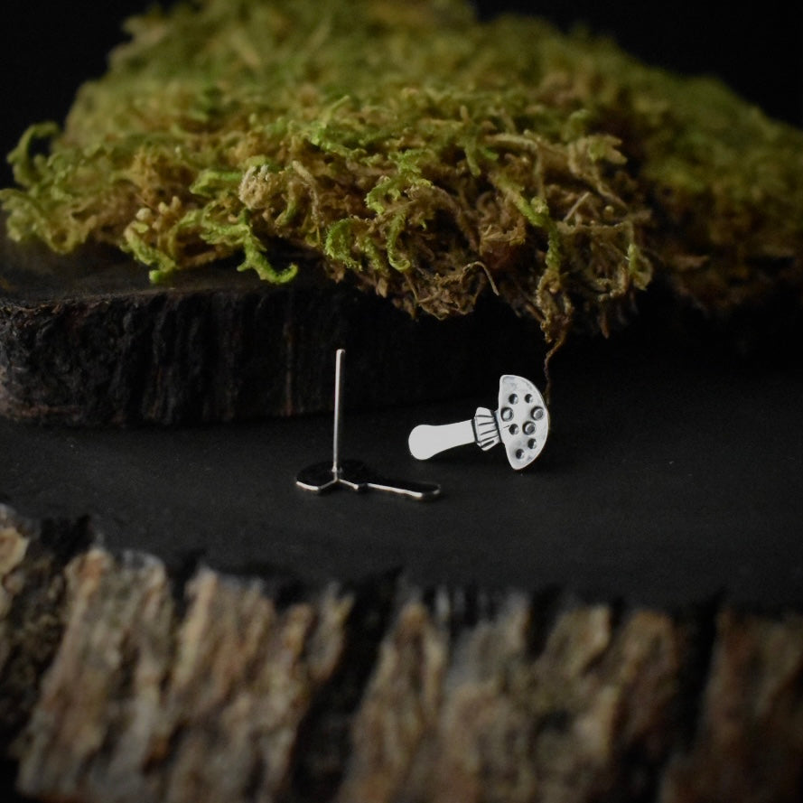 Another look at the Amanita Stud Earrings, showing their sterling silver ear wires.