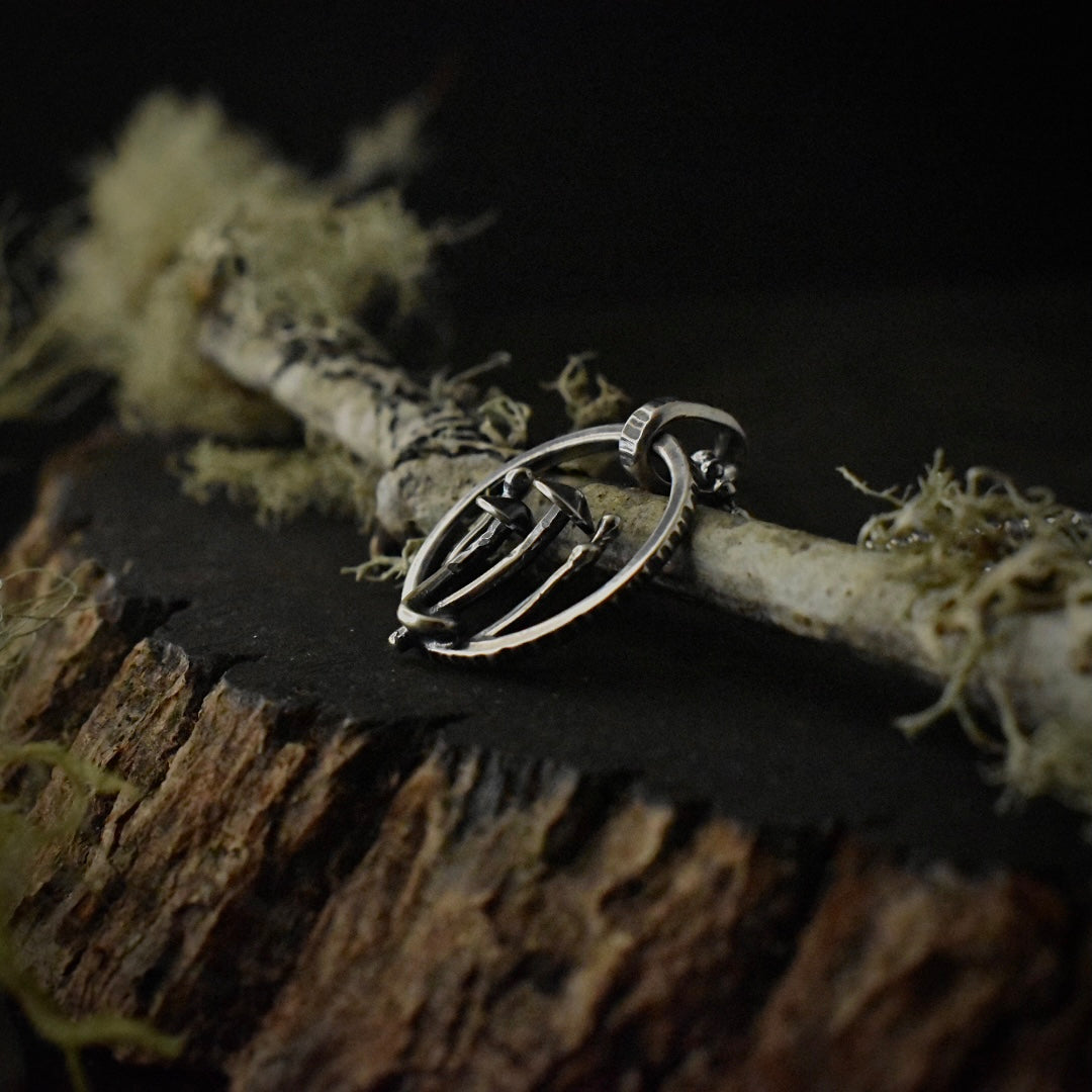 Another look at the Forest Floor Fiddling Pendant, showing the details of its textured sterling silver bail.