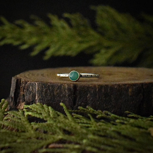 One handmade sterling silver, stackable solitaire ring, with a small setting of light green chrysoprase. 