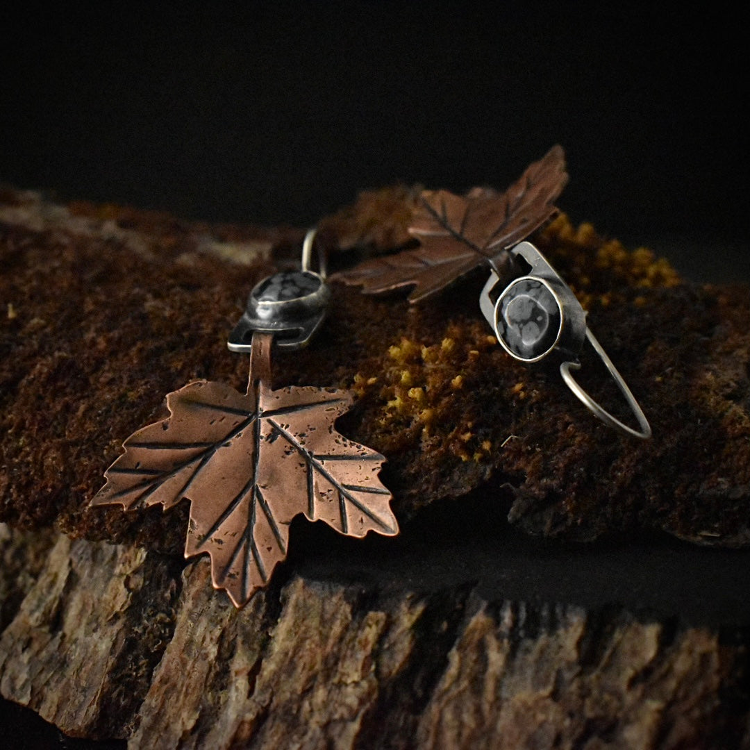 Another look at the Snowflake Obsidian Maple Leaf Earrings, showing their sterling silver ear wires. 