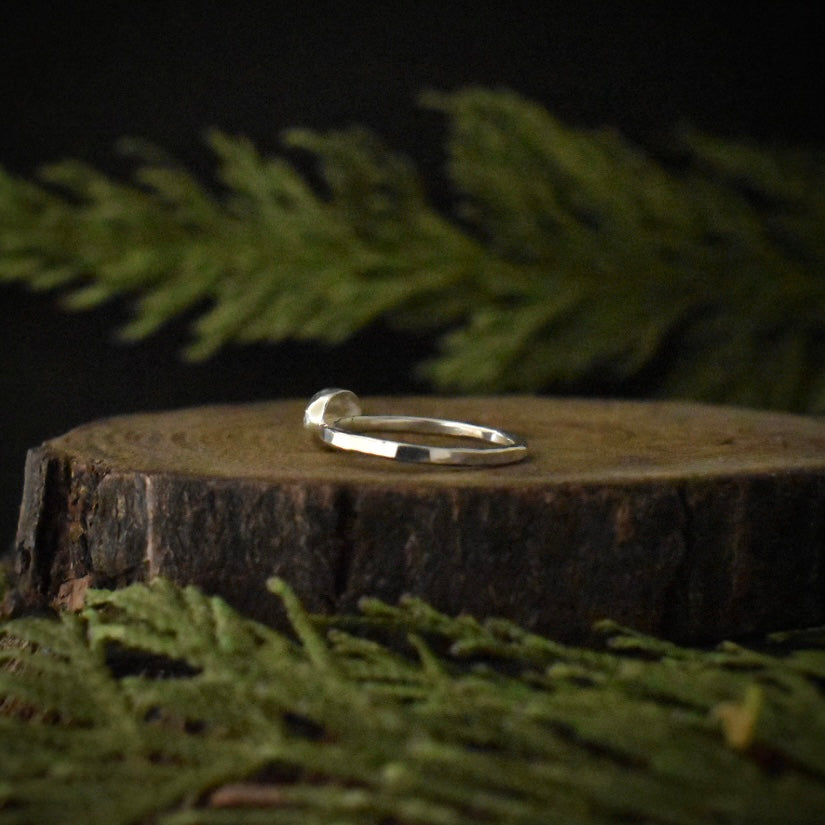 Another look at the Snowflake Obsidian Stacking Ring, showing its textured sterling silver ring band.