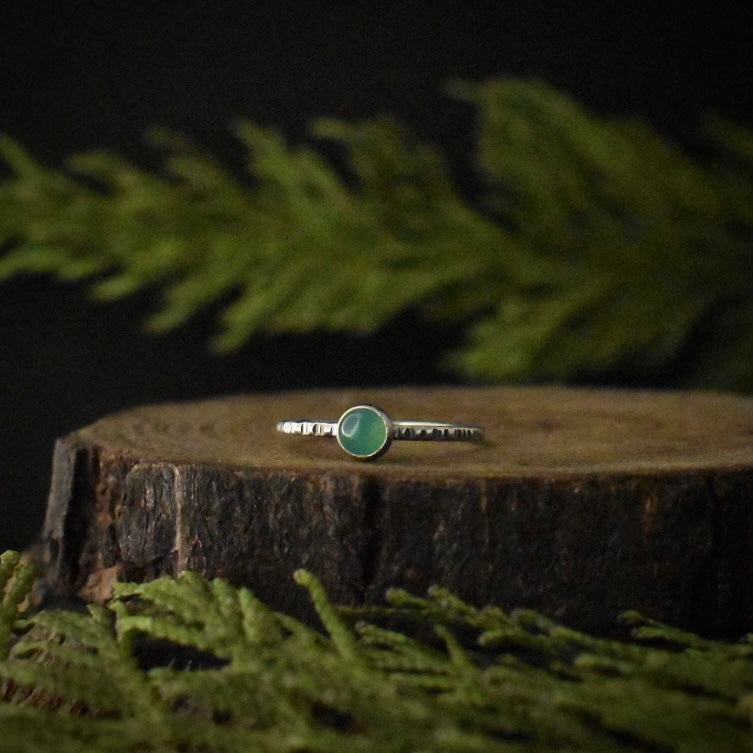 Another handmade sterling silver ring, with a small setting of light green chrysoprase. 