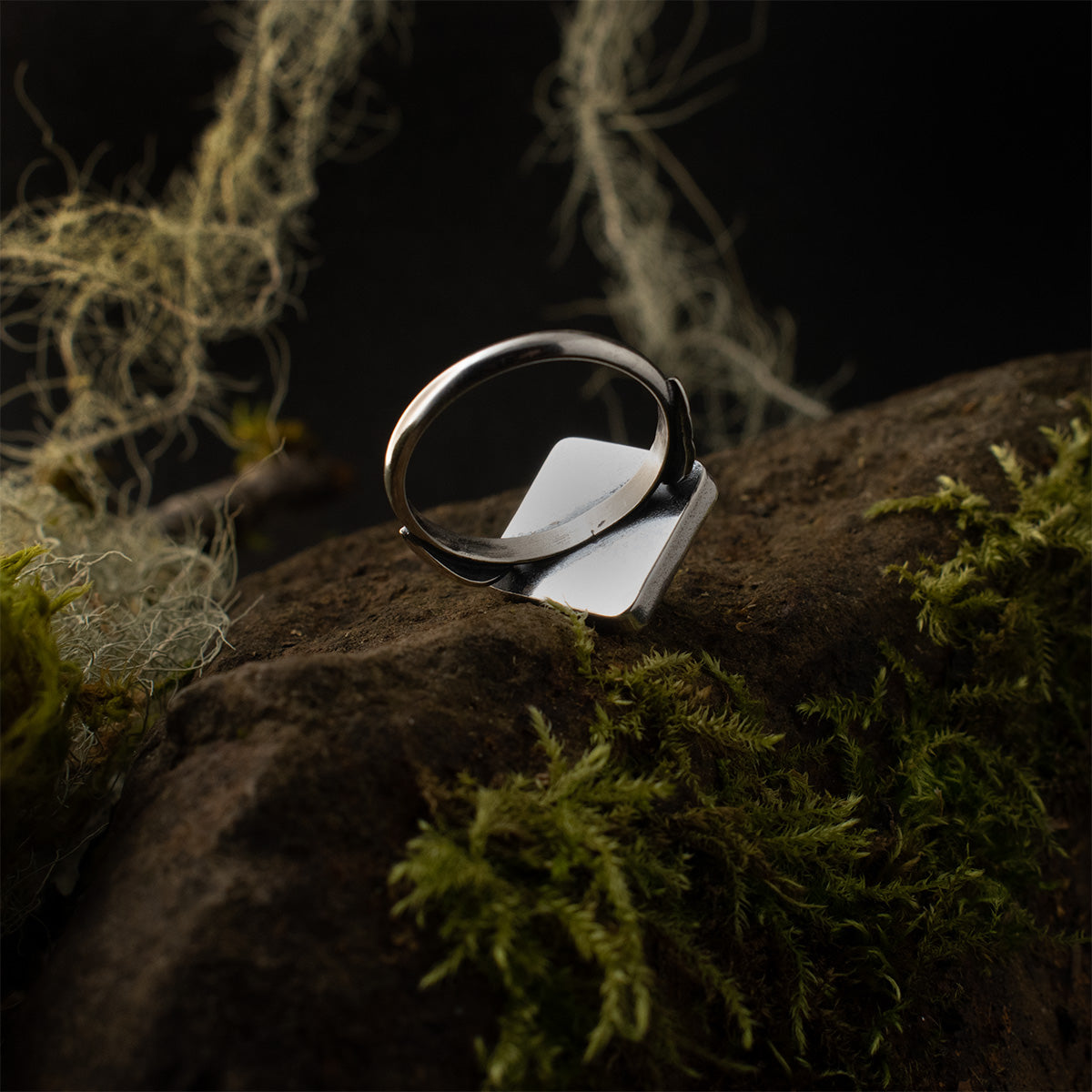Underneath the Aventurine Pyramid Double Leaf Ring, showing its polished diamond-shaped setting and its simple handmade sterling silver band.
