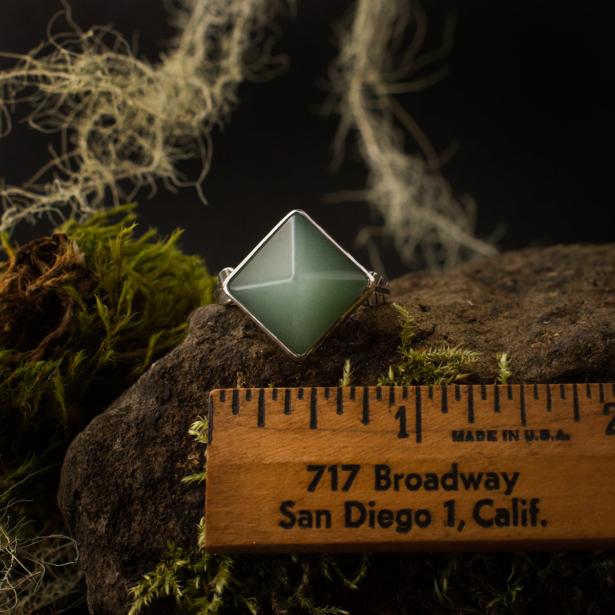 The Aventurine Pyramid Double Leaf Ring with a ruler for scale, measuring around 3/4 inches wide from point to point.