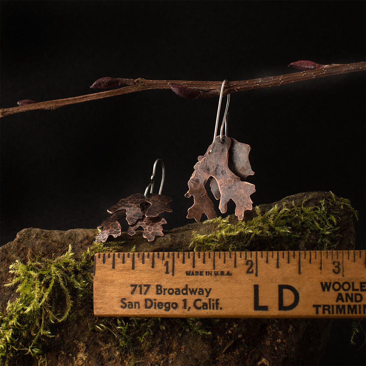 The Copper Layered Lichen Earrings with a ruler for scale, each measuring around 3/4 inches wide.