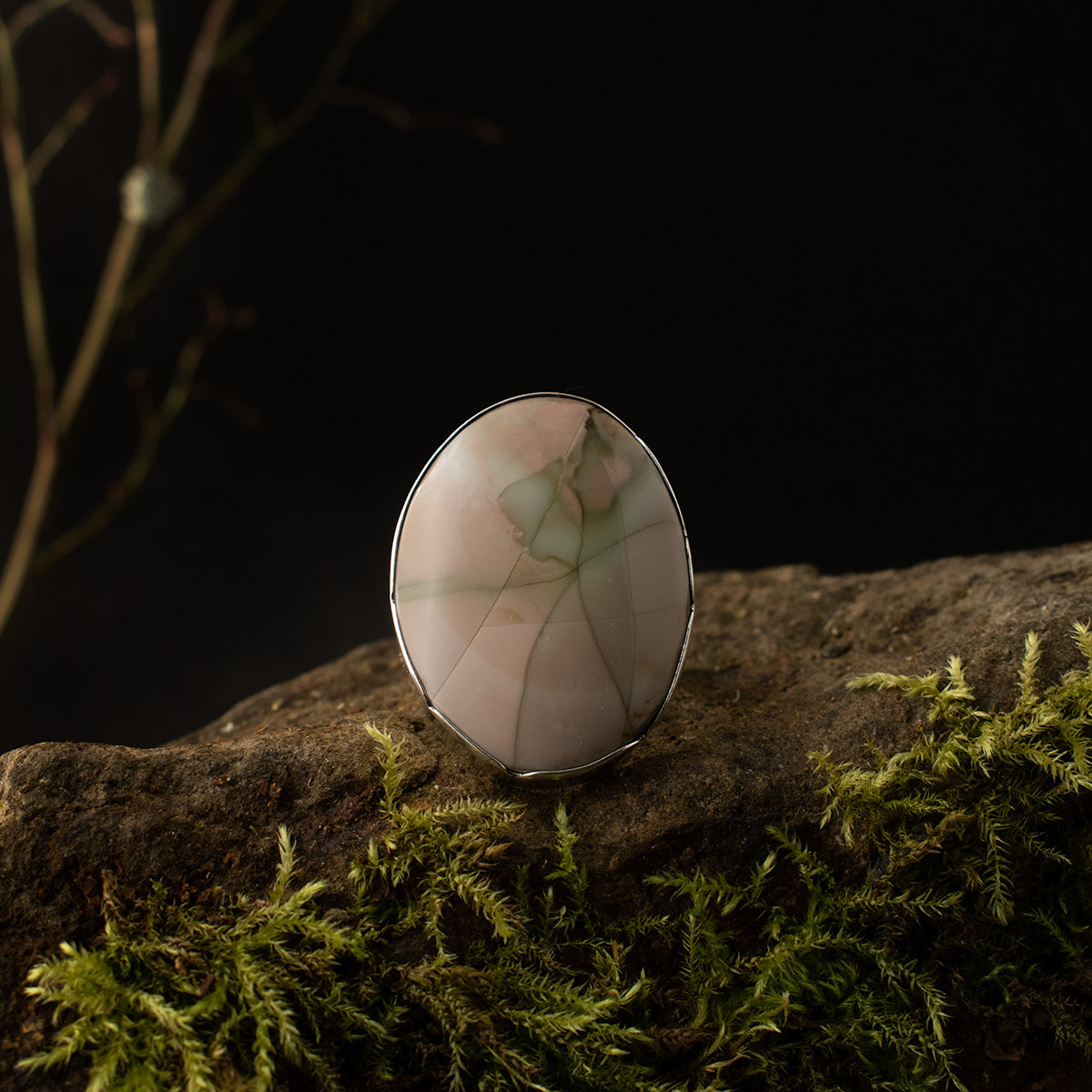 A handmade sterling silver statement ring with a large setting of imperial jasper, a softly variegated stone crackling with pastels.