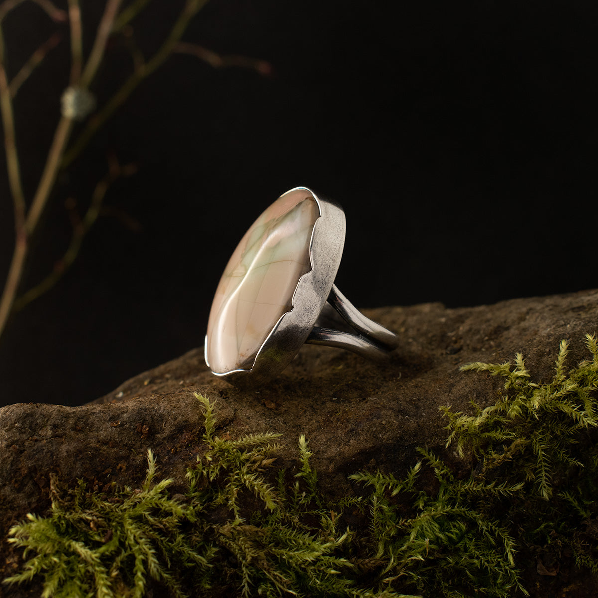 The left side of the Imperial Jasper Fracture Ring, showing its substantial sterling silver bezel, custom shaped to intersect with the stone’s natural fissures.