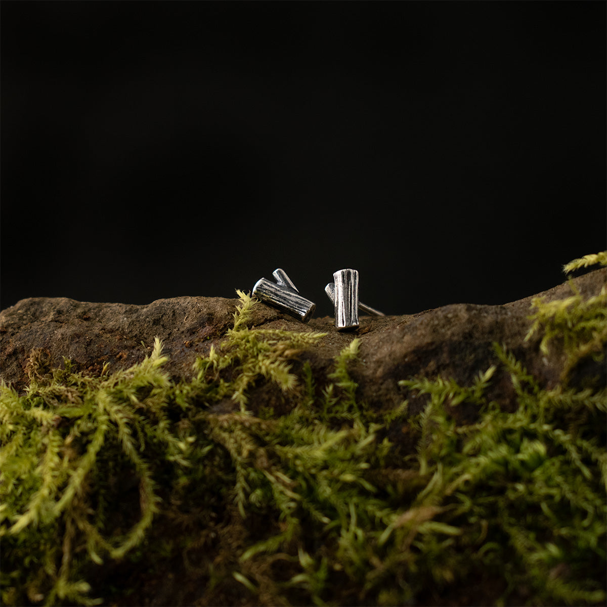 The Little Log Studs, each wee earring is showing its fine organic details, textured and patinated by hand.