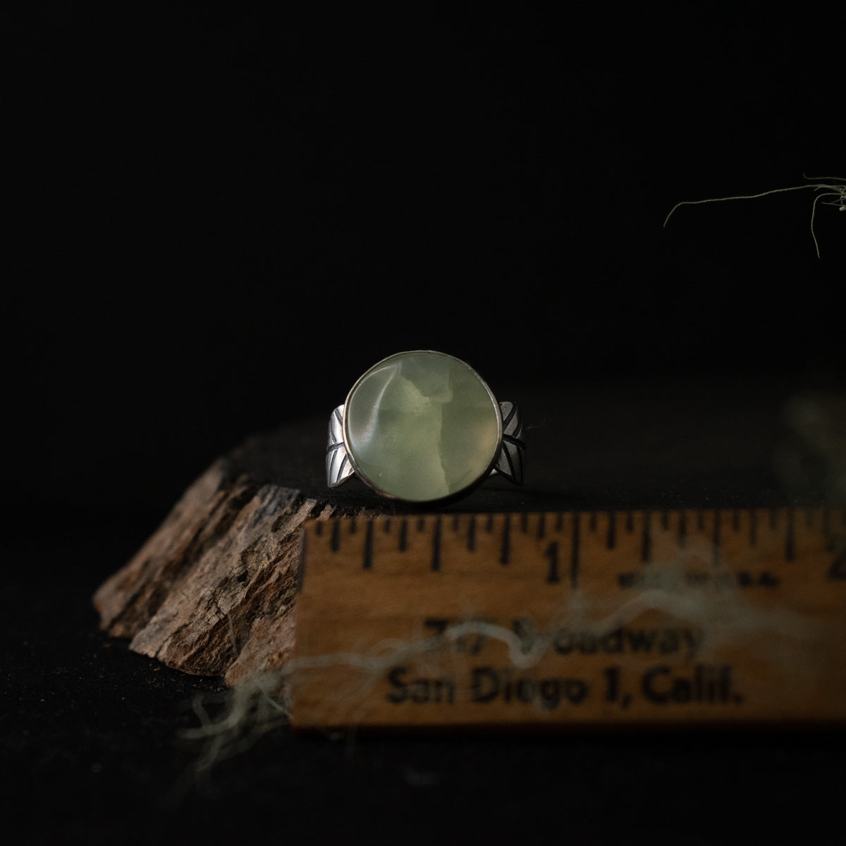 The Prehnite Double Leaf Ring with a ruler for scale, measuring around 3/4 inches wide.